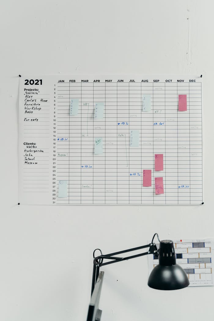 services-02 A 2021 wall calendar in a simple office setting for planning and scheduling.
